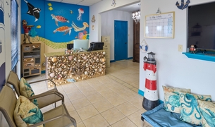 Nautical themed spa and resort lobby with a seashell reception desk
