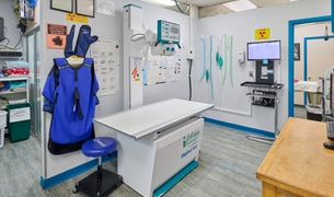 Digital X-ray suite with a Vet-Ray radiography table and lead apron